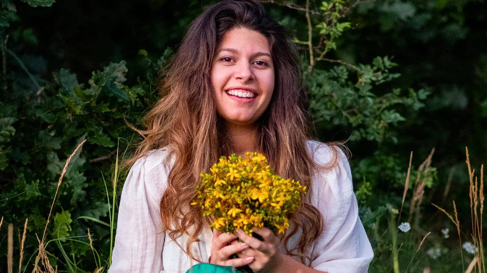 Maria Ralcheva holding Saint John’s Wort herb